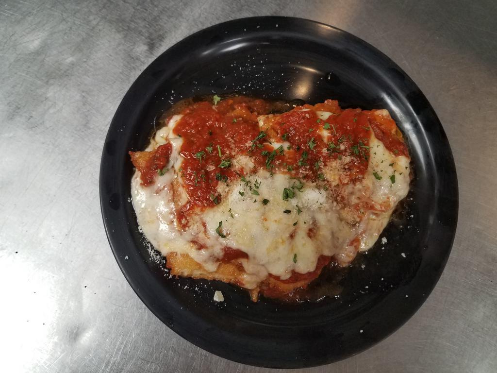 Chicken Parmigiana Plate · Fresh breaded chicken topped with our homemade tomato sauce, mozzarella cheese & fresh parsley.