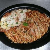 Chicken Parmigiana · Fresh breaded chicken topped with our homemade tomato sauce, mozzarella cheese & fresh parsl...