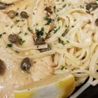 Chicken Piccata · Fresh chicken cutlets sautéed with butter in a wine sauce with capers and topped with lemon ...