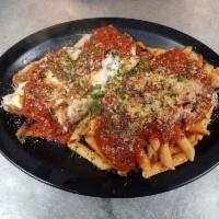 Veal Parmigiana · Fresh breaded veal cutlets topped with our homemade tomato sauce, mozzarella cheese & fresh ...