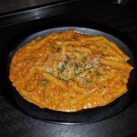 Pasta with Vodka Sauce · Sautéed ham & onions in a light tomato sauce blended with cream, butter and a splash of vodk...