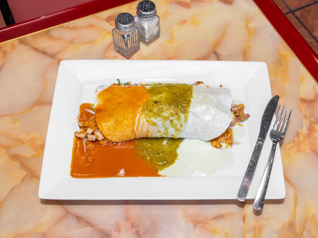 Burrito California · Flour tortillas with rice, refried beans, lettuce, sour cream, pico de gallo, guacamole, cheese, with grilled chicken or steak all smothered in red sauce, green sauce, and cheese sauce.