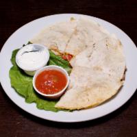Tavern Quesadillas · Cheddar cheese filled tortillas melted and grilled to perfection.