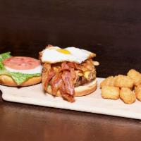 The Breakfast Burger · Try our traditional burger with a breakfast twist! Topped with bacon, fried egg and cheddar ...