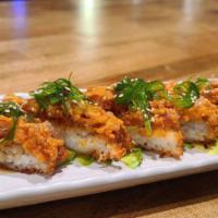 Crunch Tuna · A lightly fried sushi rice crust topped with spicy tuna, avocado, and seaweed salad drizzled...