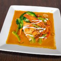 Salmon Panang Curry · Grilled fillet salmon on stream broccoli, panang curry paste, coconut milk, bell pepper, lim...