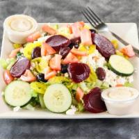Greek Salad · Feta cheese, tomato, cucumber, mild peppers, olives and beets.