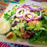 Caesar Salad · Romaine lettuce, Asiago cheese, red onions and croutons.
