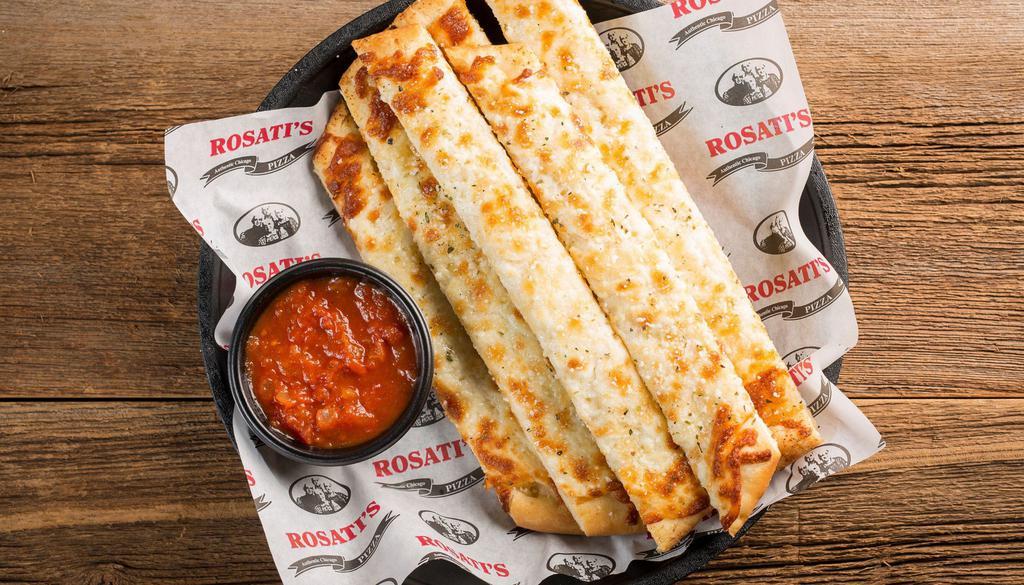 Cheesy Bread Stix · Breadsticks topped with garlic butter and mozzarella cheese and served with a side of marinara. 