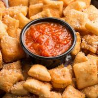 Rosati’s Dough Nuggets · Bite-sized pieces of crispy pizza dough tossed in garlic butter sauce and served with a side...