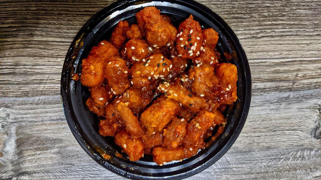 Chilli Baby Corn · A south-east asian staple of crispy batter fried baby corn pieces chunk tossed in a spicy mix of garlic, chilli, onion and peppers.
