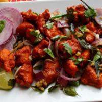 Chicken 65 · Delicious and succulent chunks of chicken marinated in yoghurt and stir fried in a tangy mix...