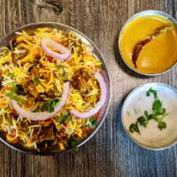 Hyderabadi Goat Dum Biryani · Long grain basmati rice flavored with saffron and cooked in a traditional hyderabdi style wi...