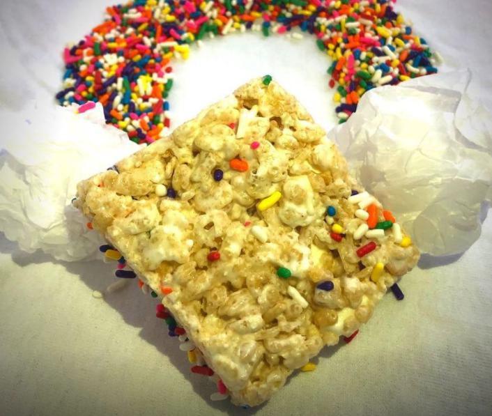 1 Piece Rainbow Sprinkle Crispy Treat · Bring some color to your snack with our rainbow sprinkle crispy treat. Rainbow sprinkles and mini marshmallows are throughout this colorful treat.