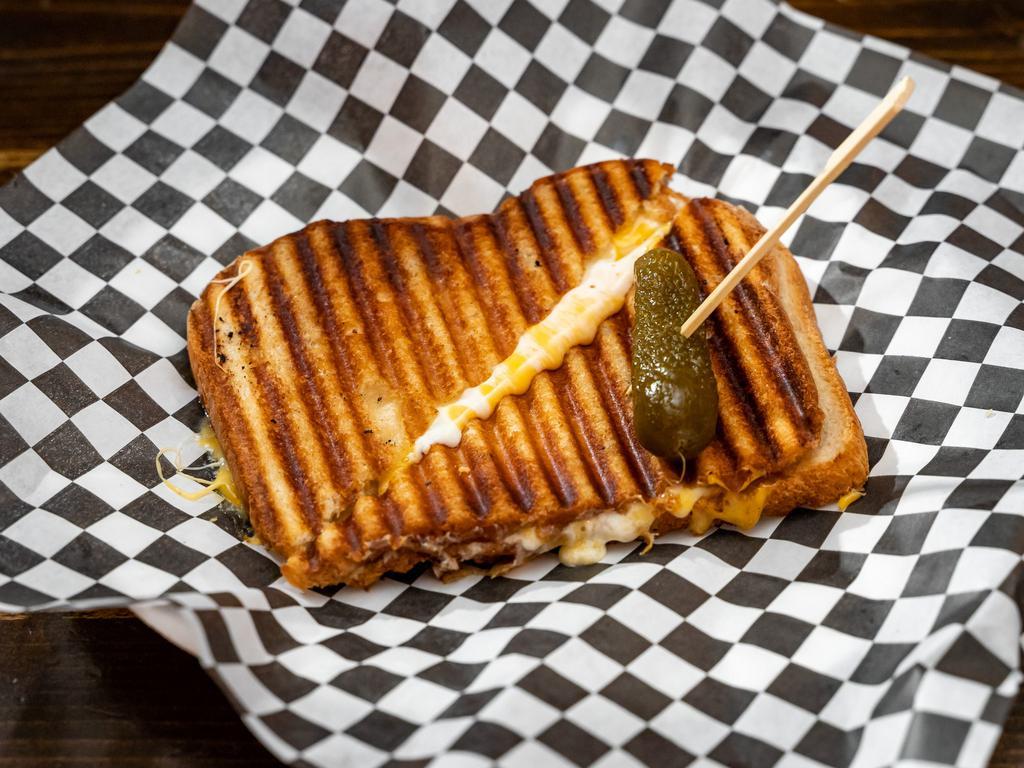The Holy Diver Sandwich  · American, cheddar and munster cheese on white. Add bacon for an additional charge.