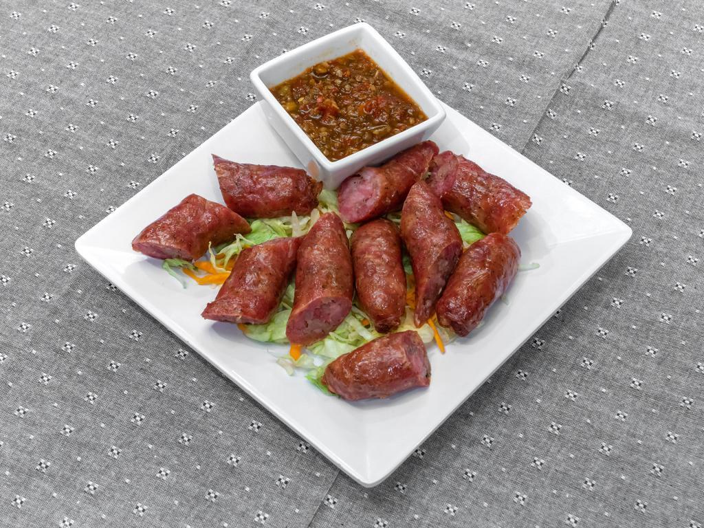 A9. Thai Sausage · 2 pieces. Sausage served with sweet or spicy sauce.

