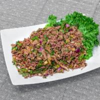  S3. Beef Larb Salad · Beef, onion, cilantro, tripe, scallion, rice powder, and lime juice.