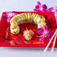 Dragon Roll · Shrimp tempura, asparagus and masago, topped with avocado served with eel sauce. 10 pieces, ...