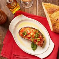 Bruschetta Pomodoro · Grilled Italian bread topped with fresh tomatoes, basil and garlic, drizzled with virgin oli...