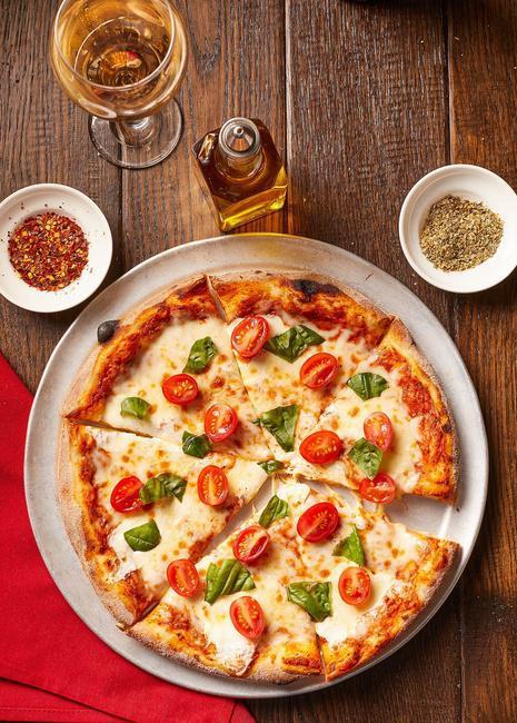 Pizza Margherita · San Marzano tomato sauce, imported buffalo mozzarella, fresh tomatoes and basil