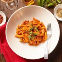 Penne Angolo · Tossed penne pasta with grilled chicken, pesto in a marinara sauce