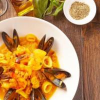 Scampi Risotto · Arborio rice, shrimp, calamari, scallops, clams and mussels in a saffron fish broth