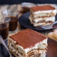 Tiramisu · Layers of espresso drenched lady fingers separated by mascarpone cream and dusted with cinna...