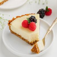 Cheesecake · Traditional New York Cheesecake flavored with a hint of vanilla, on a sponge cake base toppe...