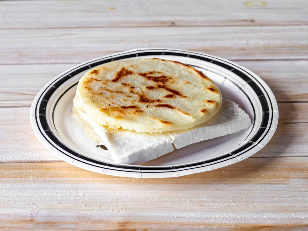 Areapa con Queso Guayanes · White corn arepa stuffed and guayanes cheese.