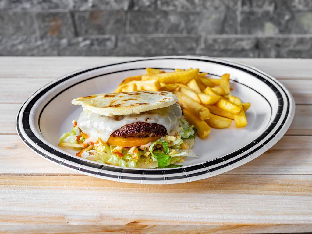 Arepa-Burger · Beef burger with arepa instead bread and fries.