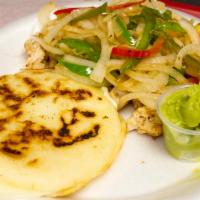 Pincho de Pollo · Grilled chicken, arepa with cheese, sauteed onion peppers and guacamole.
