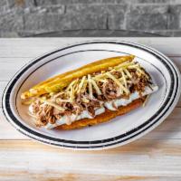 Patacon Carne · Green plantain, shredded beef, Guayanes cheese, homemade sauce and potato sticks. Fried gree...