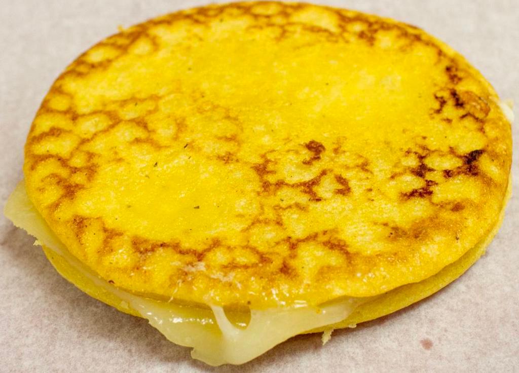 Arepa de Choclo · Corn sweet cake and mozzarella cheese.