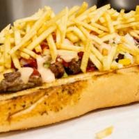 Pepito de Carne Asada · Sandwich in French bread with Guayanese cheese, corn coleslaw, potato stick, grill beef and ...