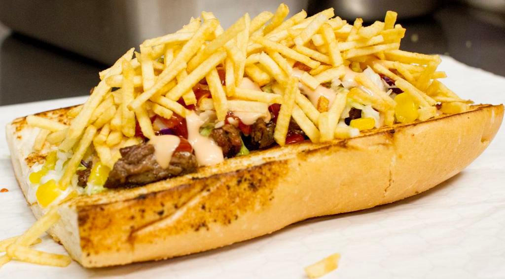 Pepito de Carne Asada · Sandwich in French bread with Guayanese cheese, corn coleslaw, potato stick, grill beef and homemade sauce.