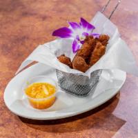 Accra Fritters · 5 pieces. Served with Caribbean spicy pikliz.