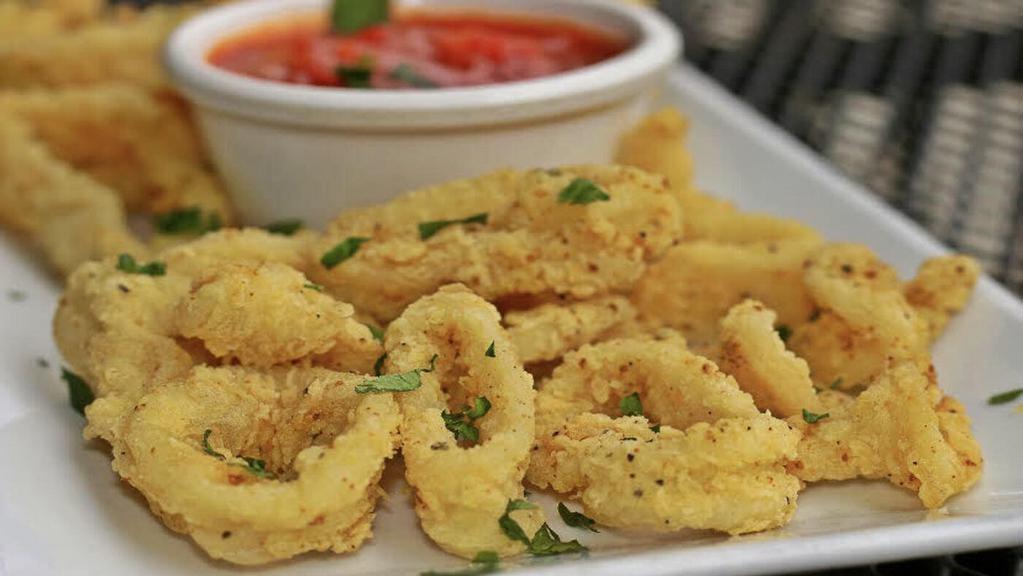 Fried Calamari · Lightly battered calamari rings with a hint of lemon pepper seasoning, fried, and served with our homemade marinara sauce.