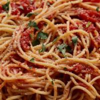 Spaghetti Marinara · Thin spaghetti noodles tossed in our homemade marinara sauce and served with 3 garlic rolls.
