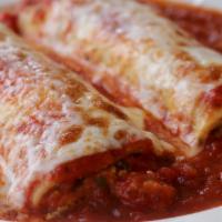 Chicken Cannelloni · 2 tubes of pasta stuffed with chopped grilled chicken, spinach, ricotta and Parmesan cheeses...
