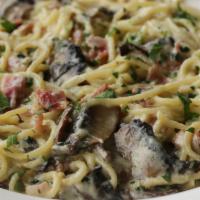 Pasta Carbonara · A favorite of guests and staff alike. Fettuccini noodles tossed in our famous carbonara sauc...