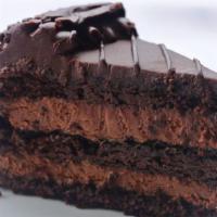 Chocolate Mousse Cake · Decadent chocolate cake layered with chocolate mousse and topped with chocolate icing.