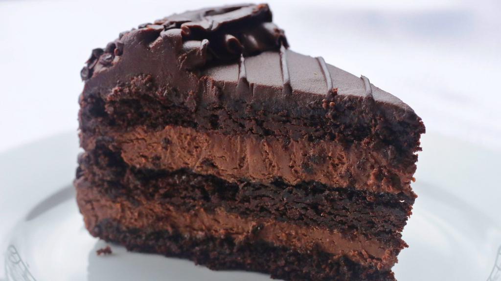 Chocolate Mousse Cake · Decadent chocolate cake layered with chocolate mousse and topped with chocolate icing.