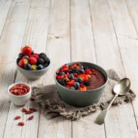 Berries and Greek Yogurt Bowl · Acai blended with mixed berries, honey and Greek yogurt. Topped with sliced strawberries, ra...