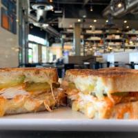 Buffalo Chicken Melt · Buffalo fried chicken breast, white cheddar, bleu cheese and pickles on sourdough served wit...