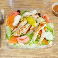 Grilled Chicken Salad · served with dressing of your choice and pita bread
