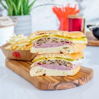 Media Noche Sandwich · Ham,Roasted Pork,Swiss Cheese,Pickles and Mustard on a Sweet Roll 