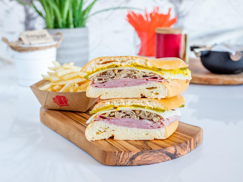 Media Noche Sandwich · Ham,Roasted Pork,Swiss Cheese,Pickles and Mustard on a Sweet Roll 