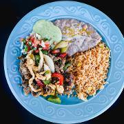 13. Fajitas chicken and steak · Grilled fajita veggies with grilled chicken and steak full of flavor garnished with lettuce, pico de gallo and shredded cheese. 
Served with rice, beans and a side of tortillas.