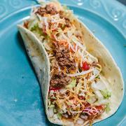 Beef Taco · Fresh ground beef taco served in a soft flour tortilla filled with lettuce, cheese, and pico...