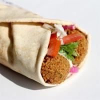 Falafel Sandwich · Crispy falafel balls wrapped in a pita with lettuce, pickles, tomatoes and topped with tahin...